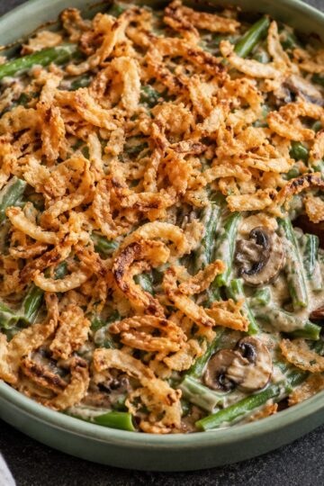 Green bean casserole with fresh beans, mushroom cream sauce, and crispy onions