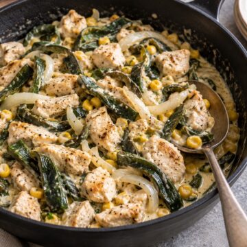 Chicken with roasted poblano strips, onion, and corn in a creamy sauce.