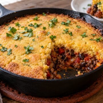 Skillet tamale pie with a golden cornbread topping and beef-and-bean filling